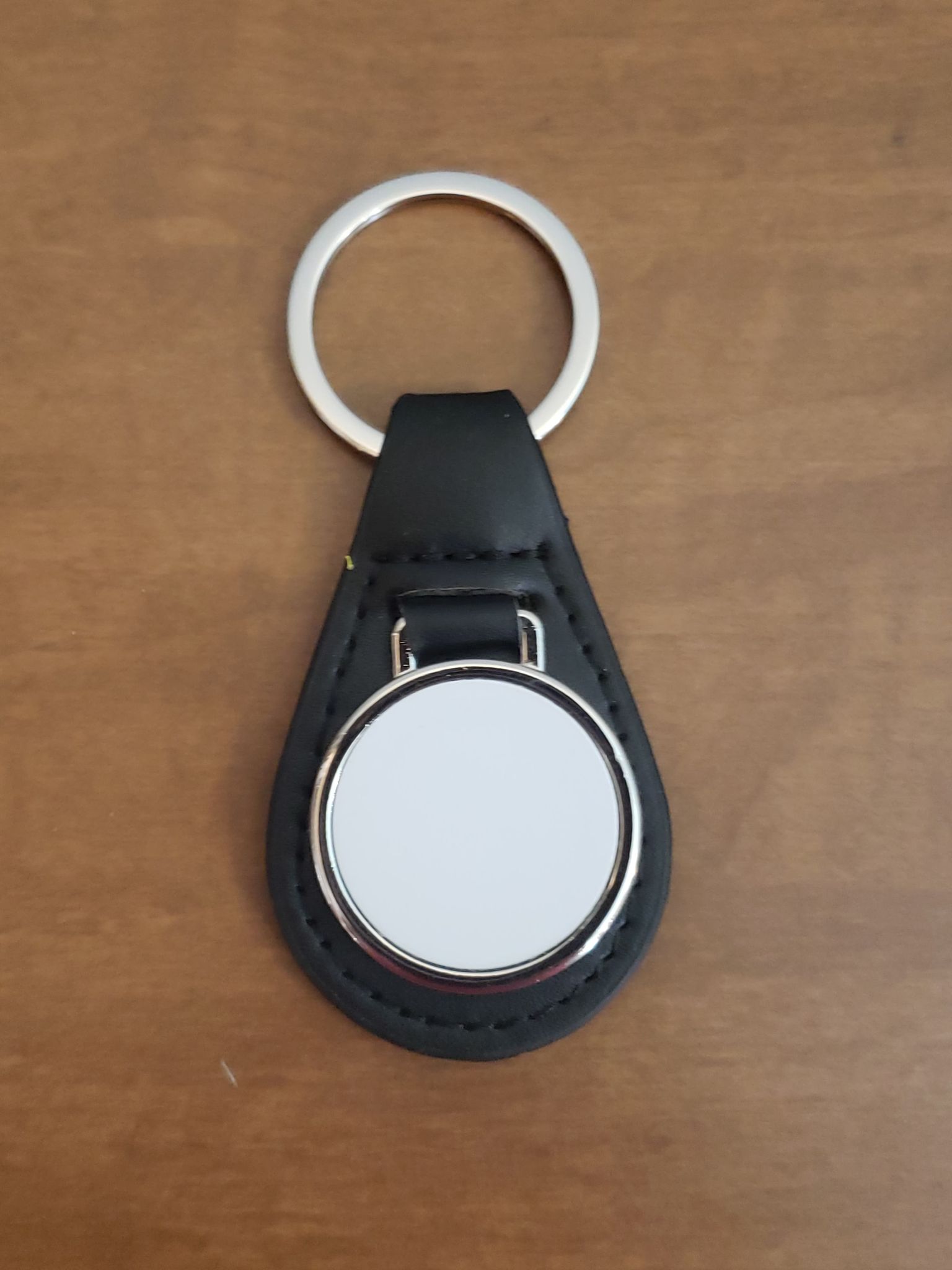 Metal keychain with black faux leather